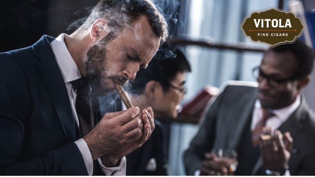 Man smoking cigar with friends